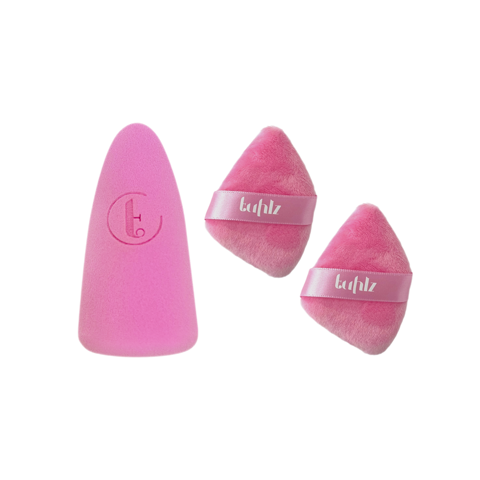 The image shows a pink abstract sponge on the left and two pink luxe powder puffs with the brand name 'tuhiz' on them on the right.