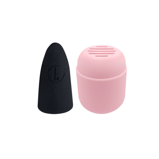 A black and pink sponge duo, with one sponge placed next to its pink case.